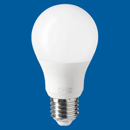 IKEA White smart light bulb on a blue background compatible with Nearsens